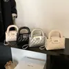 Bolsa de Mão Fashion com Fecho Rômbico Feminina 2025 Nova Bolsa de Ombro com Corrente Estilo Ocidental Simples de Nicho Bolsa Transversal