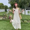 Vestido de encaje hueco sin mangas, estilo vacacional de moda este año, vestido largo estilo étnico relajado con lazo en la espalda