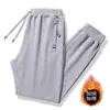Pantalones de chándal de cordero con forro polar Ropa exterior engrosada Pantalones casuales cálidos Ropa exterior Pantalones deportivos para hombre 2024 Nuevo Invierno
