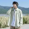 Nueva colección de primavera y otoño: camisa de manga larga texturizada, estilo unisex, corte holgado, con cuello y bolsillos, prenda exterior moderna y casual