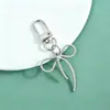 Nuevo estilo princesa fugitiva lindo llavero de lazo accesorio colgante simple DIY colgante de cuentas material al por mayor