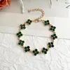 Novo Conjunto de Colar e Pulseira de Trevo de Quatro Folhas Totalmente Cravejado Transfronteiriço, Exquisito e Luxuoso, Sensação de Alto Padrão, Conjunto de Joias de Corrente para Clavícula de Nicho para Mulheres