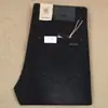 Pantalones Rectos Sueltos Elásticos Delgados Negros Grises de Primavera y Verano Fibra de Poliéster Pantalones de Mezclilla para Hombres de Negocios