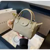 Bolso de Hombro Diseño de Nicho Bloques de Color Forma de Dumpling 2024 Otoño e Invierno Nuevo Bolso Cruzado de Hombro Bolso Simple para el Trabajo