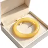 Imitação de fábrica pulseira de jade pulseira de vidro pagamento de dívidas Jade barra redonda leite amarelo jade pulseira tenda Jade 10 yuan modelo