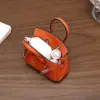 Nuevo y moderno colgante de mini bolso de platino, bolso de lipstick de alta gama, decoración de bolso para auriculares, accesorio de llavero para coche, venta al por mayor