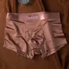 Ropa interior de satén de lujo ligero para hombre, seda helada, alta moda nude, pantalones cortos tipo bóxer con entrepierna, venta al por mayor