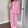 Conjunto de Pijama Rosa Xadrez de Manga Longa e Calça Longa Que Pode Ser Usado Fora, Novo Lançamento Outono Europeu e Americano 2026 Roupas de Casa Femininas Transfronteiriças