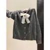 Cárdigan de punto con lazo de encaje para mujer, otoño e invierno, con botones en forma de corazón, suéter de corte holgado, top suave y femenino, prenda de abrigo