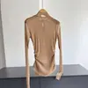 2026 Nueva Camiseta de Cuello Alto Fina Plisada Adelgazante Bodycon Dobladillo Irregular Top Pequeño Venta al por Mayor H16AT08105