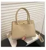 Bolso Cubo Retro Portátil 2026 Comercio Exterior Invierno Nuevo Bolso de Hombro Texturizado de Moda Bolso Cruzado Casual Versátil