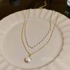 Collar de perlas de doble capa estilo retro de lujo ligero coreano para mujer, elegante cadena de clavícula de alta gama, accesorios de celebridades de Internet al por mayor