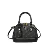Popular bolsa europea y americana vintage de concha floral, bolso de mano versátil de alta gama, moda transfronteriza 2026, bolso de hombro, bolso cruzado para mujer