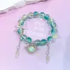 Pulsera de cristal de color degradado de 10 mm para mujer, accesorio dulce y versátil para estudiantes, alas de corazón, pulsera de cristal de flor de cinco pétalos