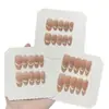 Una [Cadena de Cristal Nude] Temperamento Simple Nude Hielo Rosa Transparente Hebilla Apilada Diamantes de Imitación Ojo de Gato Sonriente Uñas Portátiles Hechas a Mano