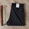 Pantalones casuales de primavera y verano para hombre, corte recto fino, antiarrugas, sin planchado, Tencel algodón, negocios, alta gama, elástico, pantalones negros