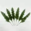 Suministro Especial Transfronterizo Navidad PE Nuevo Estilo Árbol de Navidad Simulación 9 Ramas Agujas de Pino Ramas de Pino Arreglo Floral Adorno de Escritorio Decoración
