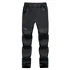 Pantalones softshell suaves al por mayor para deportes al aire libre para hombre, corte ajustado, engrosados, nuevos pantalones softshell de forro polar para otoño e invierno, pantalones de senderismo para mujer