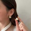 Pendientes de red rojos con diseño de nicho de lujo, de alta gama, con hebilla de oreja de doble cara, de exquisito temperamento dulce y llenos de perlas de diamante