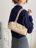 El popular bolso baguette de nicho de lujo de otoño, un diseño de alta gama, moderno y minimalista, perfecto para ir al trabajo y versátil para el uso diario como bolso de mano, bolso de hombro o bolso de axila