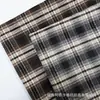 Tela de cuadros teñida en hilo cepillado de otoño e invierno en stock para exportación de ropa, ropa de hombre y mujer, ropa infantil, material para pantalones, tela para camisas