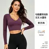 Nuevo top de yoga cruzado en la espalda con mangas largas y almohadilla para el pecho incorporada, hecho de spandex Xiaoxing de alta elasticidad, adecuado para Pilates y fitness, para mujeres
