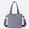 Bolsa tote pequena para mulheres, bolsa de tecido leve estilo coreano, bolsa de almoço de mão, bolsa de ombro versátil simples estilo casual para o dia a dia