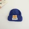 Sombrero tejido cálido de otoño e invierno para niños y niñas, sombrero de lana cómodo para bebé con etiqueta de oso lindo para protección de oídos