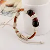 Comercio exterior exportación joyería joyería pequeña al por mayor pulsera tejida de piel de vaca pulsera de cuero vintage joyería de tienda de 2 yuanes