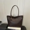 Outono 2026 Nova Moda Textura Tecida Grande Capacidade Luxo Leve Estiloso Simples Versátil Cor Sólida Ombro Único Mão Bolsa Tote