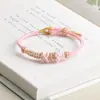 Pulsera de cuerda tejida a mano de flor de durazno productos semiacabados se puede usar 3D oro duro cuelga libro rojo pequeño con pulsera ajustable