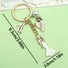 Llavero colgante de aleación de gota de aceite estilo coreano transfronterizo, llavero de cadena de perlas para bolso de mujer