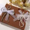 Moda Coreana Encaje Perla Imitación Hebilla de Lazo DIY Cadena para Bolso Teléfono Móvil Llavero Colgante Hebilla de Zapato Accesorios