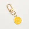 Nuevo llavero de metal con forma de emoticono arcoíris, regalo para el primer día de clases, joyería decorativa, regalo transfronterizo