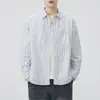 Camisa de hombre de tela Oxford a rayas estilo japonés 2026 nuevo otoño algodón puro cuello camisero manga larga chaqueta venta al por mayor