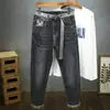Pantalones cónicos de alta calidad para otoño 2026, jeans sencillos de mezclilla elástica color gris oscuro, pantalones para hombre con cinturón, producto nuevo