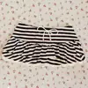 Minifalda a rayas de bloqueo de color estilo callejero coreano y japonés, línea A, sexy y a la moda, falda ultracorta versátil con cordón Y2K para chica popular, estilo nuevo