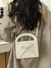 Bolsa de mão simples com laço transfronteiriça para mulheres, nova bolsa elegante e versátil de alta qualidade para ombro e transversal 2026