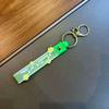 En stock, llavero con colgante de flor pequeña, nuevo colgante de color gelatina, correa de mano, pulsera de cuerda de cuero, pequeño llavero de regalo.