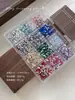 Accesorios de arte de uñas de taladro irregular de fondo plano de 12 rejillas Cruz Súper Flash Corazón Estrella Gota de Agua Uñas DIY Taladro de Resina Venta al por Mayor