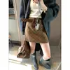 Falda Corta de Lana a Cuadros Retro Coreana Moqie Gaohui Ouni de Cintura Alta Adelgazante Línea A con Cinturón Mq1022