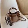 Bolso de Hombro Individual de Textura de Alta Calidad a la Moda para el Trabajo Nuevo Otoño 2026 Versátil Bolso Cubo Elegante Bolso de Mano Cruzado de Moda