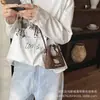 Otoño 2026 Nuevo Bolso de Hombro Bordado Corazón Dulce de Moda Dibujo Animado Lindo Bolso de Mano para Bebé Mini Bolso Infantil