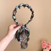 Faixa de Cabelo Trançada com Fita Floral Ondulada para Mulheres 2026 Novo Acessório de Cabelo Versátil Elástico de Cabelo Faixa de Cabeça Topo Craniano Superior Acessório de Cabeça