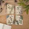 Clásicos Atemporales: Cuaderno de Espiral A7 Estilo Chino Tradicional - Mini Cuaderno de Bolsillo con Textos Antiguos, Pipa y Motivos de la Torre Yueyang - Al Por Mayor