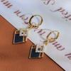 Pendientes de Diamante Negros Personalizados de Moda Cobre Chapado en Oro Real Lujo Ligero Moda Alto Sentido Elegante Elegante Hebilla de Oreja Pendientes Viento Frío