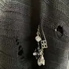 Nuevo Abrigo de Punto Holgado con Cuello en V de Longitud Media Estilo Wasteland Vintage Otoño 2026 con Dobladillo de Borlas