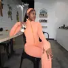 Desarrollado por Anno) Conjunto de tres piezas de ropa para mujer europea y americana 2026: top casual de manga con cremallera y cuello alto, pantalones largos casuales y diadema de moda
