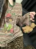 Conjunto feminino de duas peças casual retrô de outono com estampa de desenho animado listrado e estampa de leopardo, novo para 2026, calça longa para usar em casa e ao ar livre
