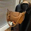 Bolso tejido simple para mujer, nueva colección de verano 2026, bolso de hombro, bolso cruzado, bolso de mano, estilo coreano, adecuado para ir al trabajo, con un diseño sofisticado y elegante, parecido a un delicado dumpling